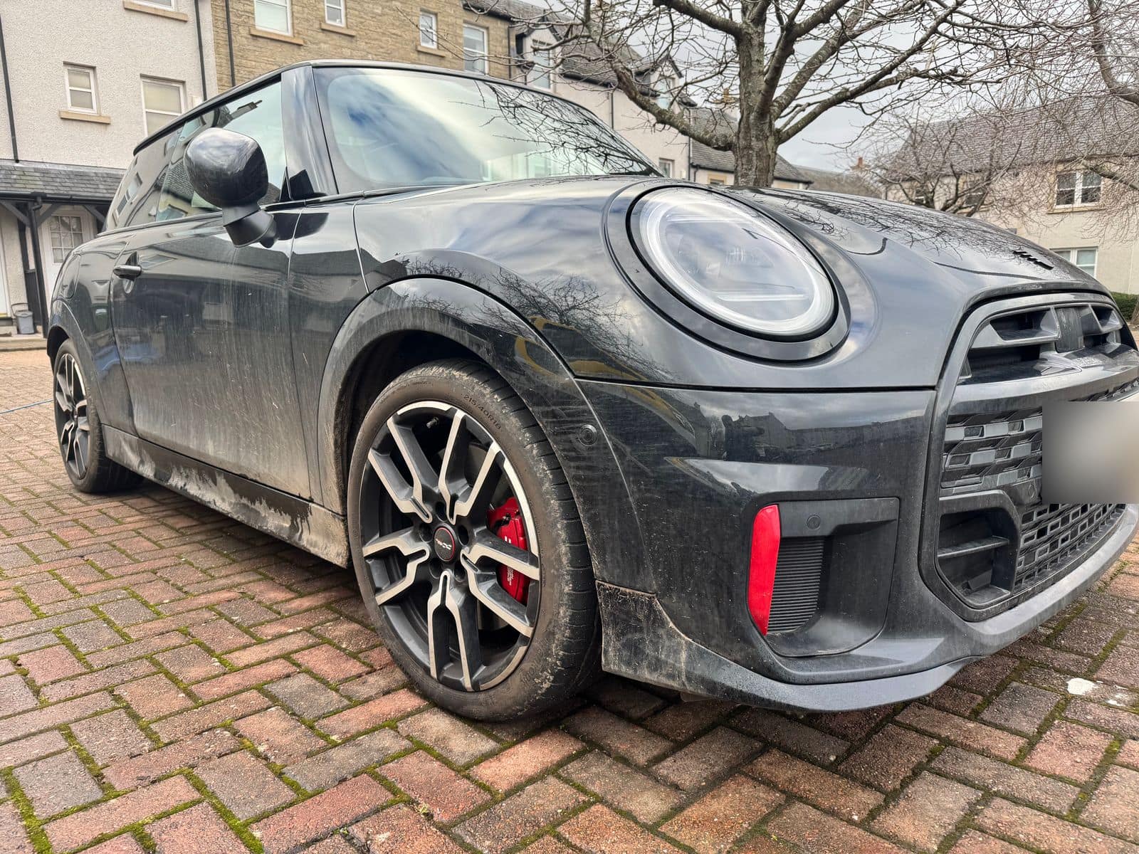 Before: black Mini dulled grey with road grime